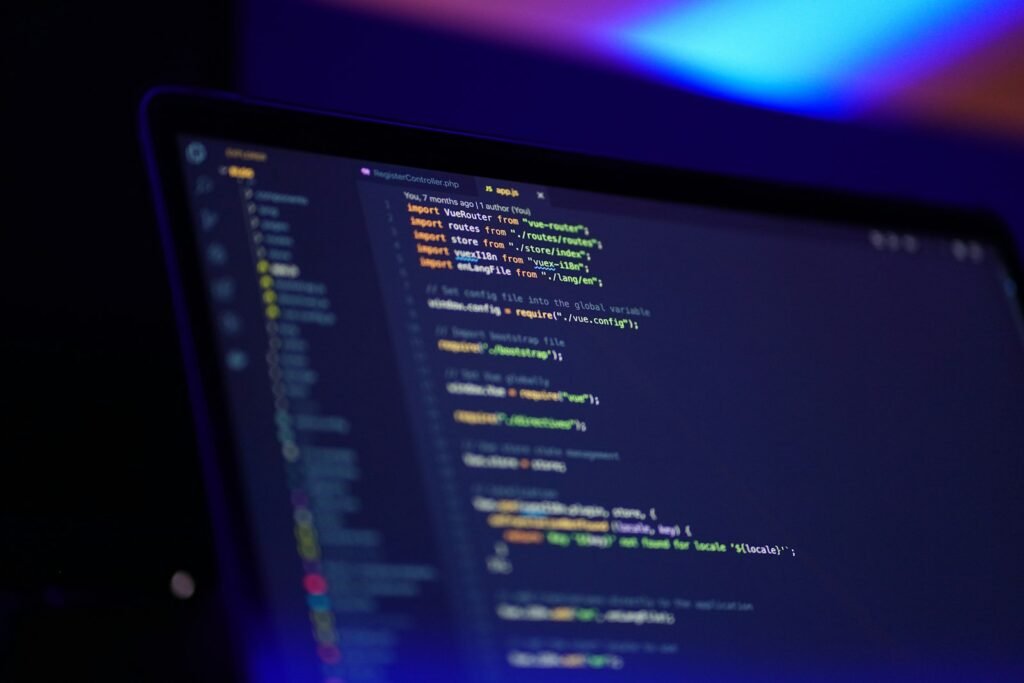 Laptop screen displaying colorful code